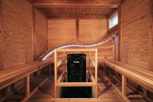 a sauna with a bottle of wine in it at BLANC FUJI in Fujiyoshida