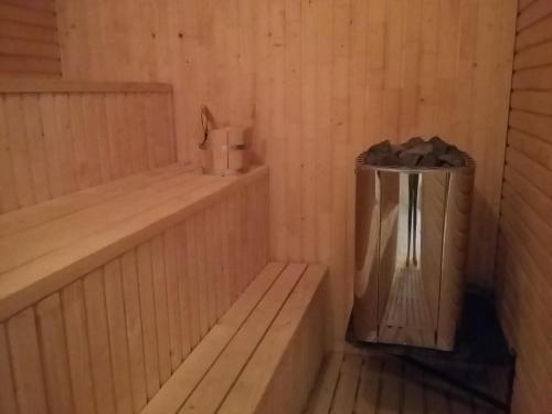 a sauna with a trash can in the corner at Hotel Auto Jas in Nitra