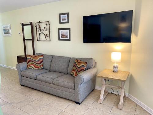 a living room with a couch and a table at Beachgate Condo Suites and Hotel 533 condo in Port Aransas