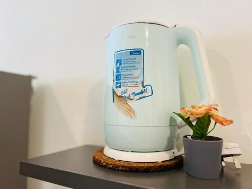 a mixer sitting on a counter next to a plant at Pinnacle Pj by DeUrban in Petaling Jaya