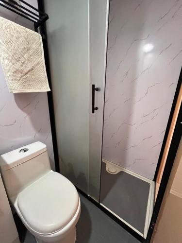 a bathroom with a toilet and a shower at One life Glamping Tent in Rawson