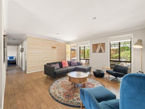 a living room with a couch and a table at Little Margs in Margaret River Town