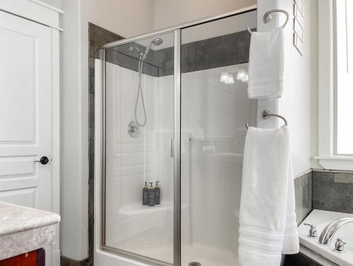 a shower with a glass door in a bathroom at Mountain View Adventures in Heber City