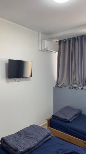 Llit o llits en una habitació de adam dortoir