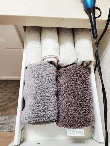 a pile of towels on a shelf at Irvine Spectrum 1 bed 1 bath in Irvine
