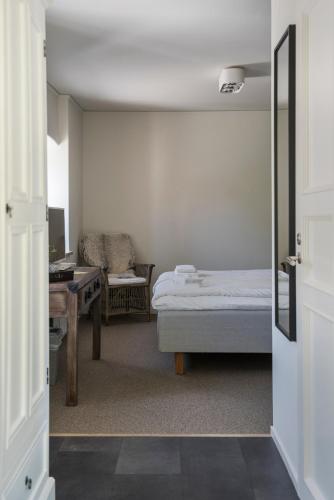 Cama o camas de una habitación en Värdshuset Lindgården