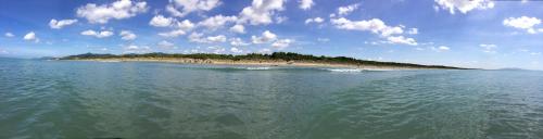 an island in the middle of a body of water at Tenuta le marze in Castiglione della Pescaia
