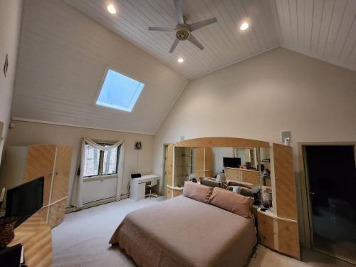 a bedroom with a bed and a ceiling fan at Eagles Nest Mansion in Montgomery