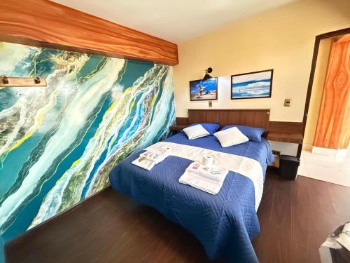Llit o llits en una habitació de Hotel Elom