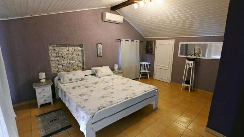 a bedroom with a bed in a room at Villa Buby by Villas Guide in Kraljevica