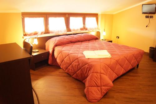 Postel nebo postele na pokoji v ubytování B&B Il Fruscio