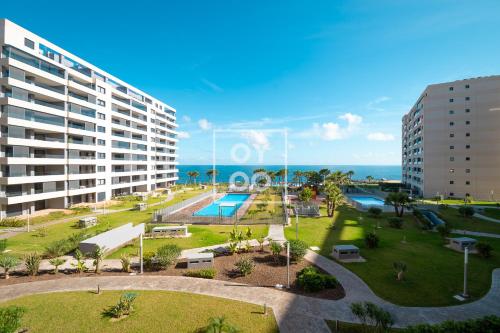 Beachfront Bliss apt, with heated pool, by OYOOSTAYS