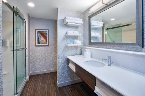 a bathroom with a sink and a mirror at Hampton Inn North Little Rock McCain Mall, AR in North Little Rock