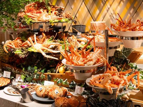 a buffet with many different types of seafood in buckets at Hotel Abest Sapporo in Sapporo