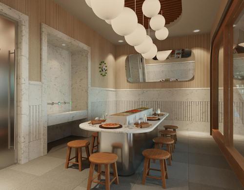 a restaurant with a table and stools in a room at Azure Villas By Cornelia in Belek