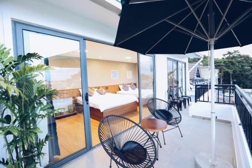 En eller flere senge i et værelse på TTR Studio Apart' Hotel Dalat