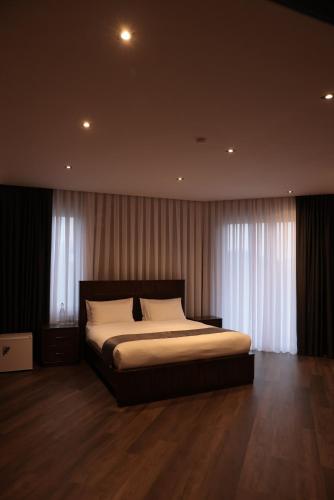 Krevet ili kreveti u jedinici u okviru objekta Onyx Hotel