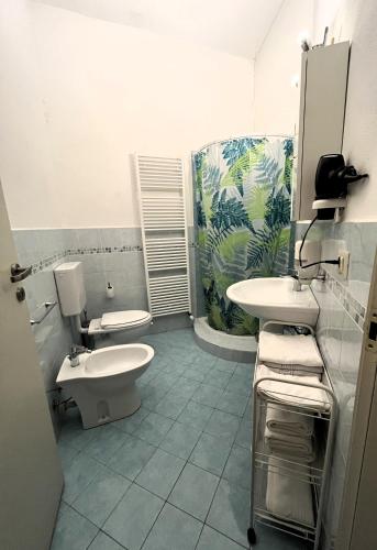 a bathroom with a toilet and a sink at La Fornace in Garessio