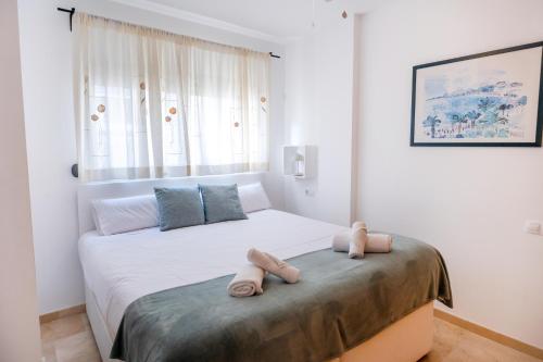 a bedroom with two beds with towels on them at Casa Alicia Altea By DelucaCo in Altea