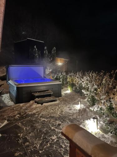 a stage with blue lights in a field at night at Hillside Chalet Kreischberg in Sankt Lorenzen ob Murau