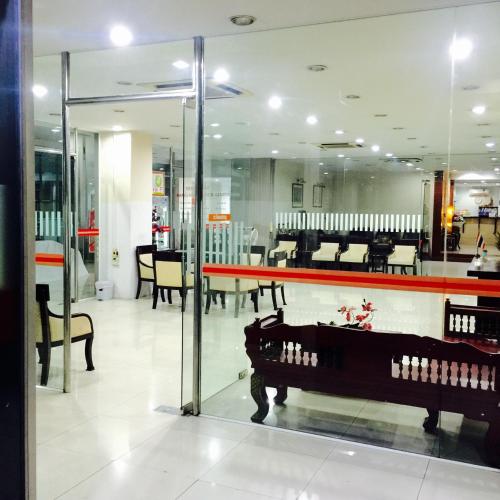 a store with tables and chairs in a room at Mall Suites Hotel in Bangkok