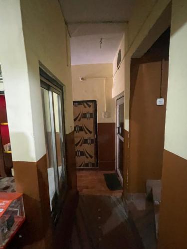 an empty room with a door and a hallway at Shivangi hotel in Bareilly