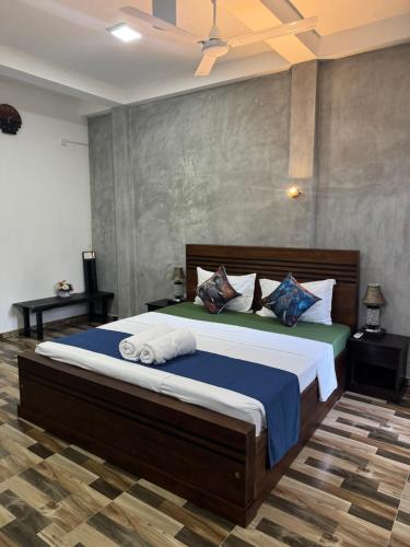 a bedroom with a large bed in a room at The La Nature Villa in Wadduwa