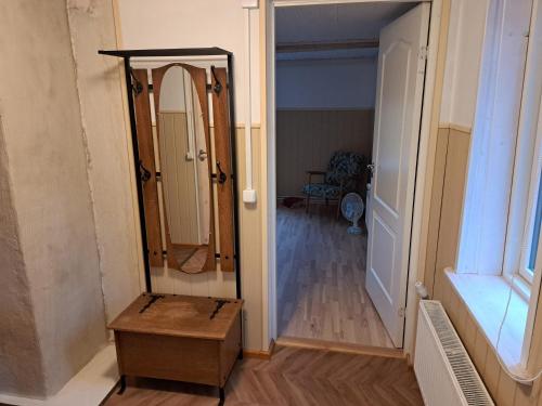 a dressing room with a mirror and a hallway at Parkal Apartments in Paide