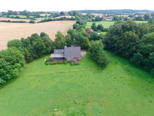 an aerial view of a house on a field at Ferienhaus Ostsee in Rabenkirchen-Faulück