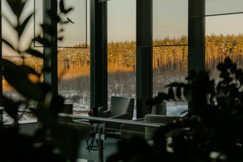 a room with a window with a view of trees at Hunguest Saliris in Egerszalók