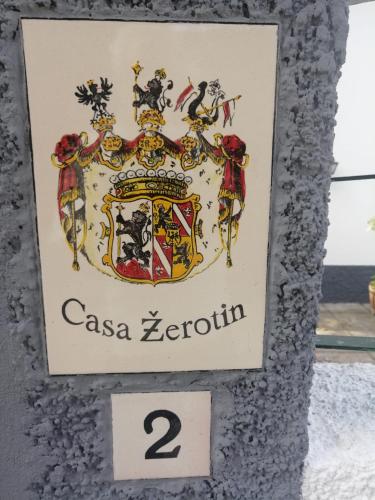 a picture of a crest on a wall at Casa Žerotín in Funchal