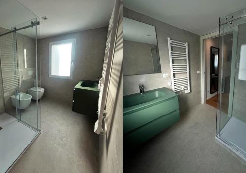 a bathroom with a green sink and a toilet at Boutique Hotel Magenta in Magenta