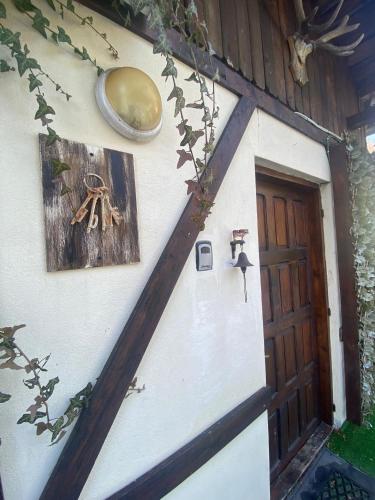 a front door of a house with a wooden door at Chalet Traian & Ruxandra in Sinaia