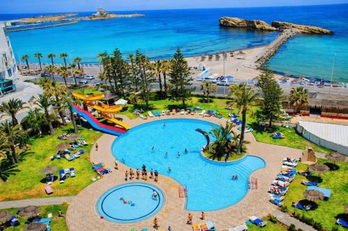 an aerial view of a pool at a beach at Hotel El Habib Monastir in Monastir