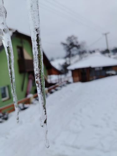 a close up of icicles on the branches of a tree at Kuca za odmor ViP in Kremna