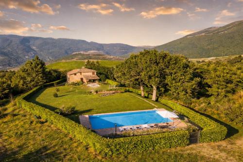 an aerial view of an estate with a swimming pool at VILLA NASCA - Ville Carborello in Castelraimondo