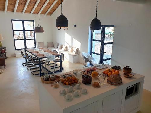 a living room with a table with fruit on it at Uma Casa Rural in Santa Bárbara de Nexe