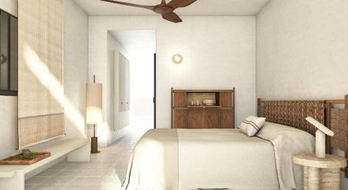 a bedroom with a bed and a ceiling fan at Melian Boutique Hotel & Spa in Pollonia