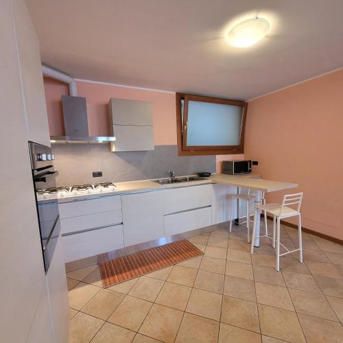 a kitchen with a sink and a counter top at L'Antico Fienile Mountain Lake Iseo Hospitality in Fonteno