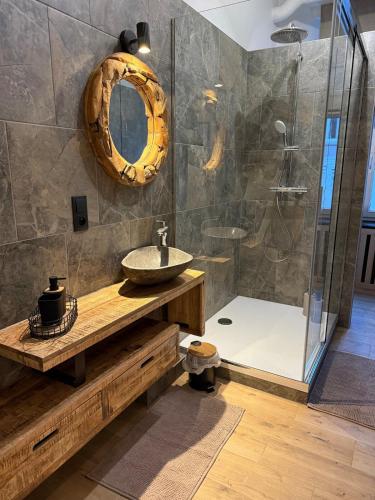 a bathroom with a sink and a shower at Loft by GIORGI - Centre de Bastogne in Bastogne