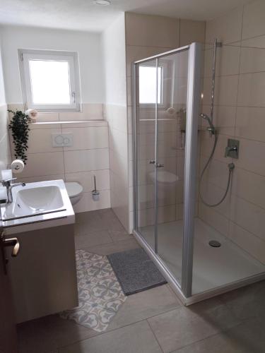a bathroom with a shower and a sink at Unterkunft-Uettingen in Uettingen