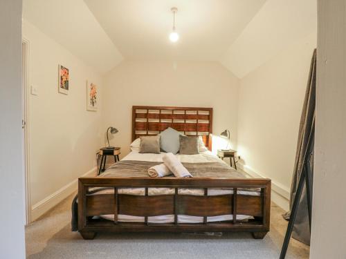a bedroom with a large bed in a room at The Pantiles in Norwich