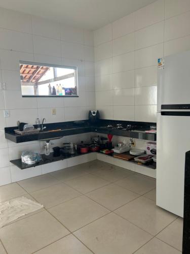 a kitchen with a sink and a refrigerator at Casa Prado in Prado