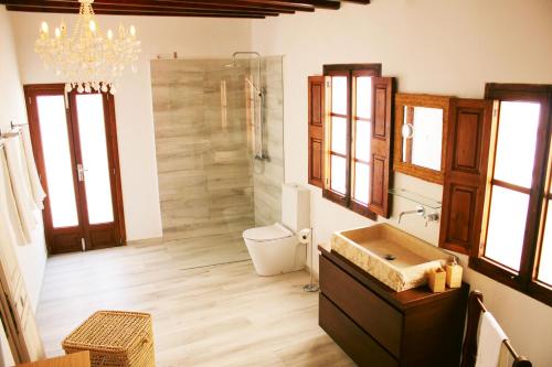 a bathroom with a sink and a shower and a toilet at Stadthaus Ca Sa Batlessa in Arta in Artá