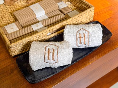 two pillows on a tray on a table at Arambhaya Boutique Hotel in Kandy