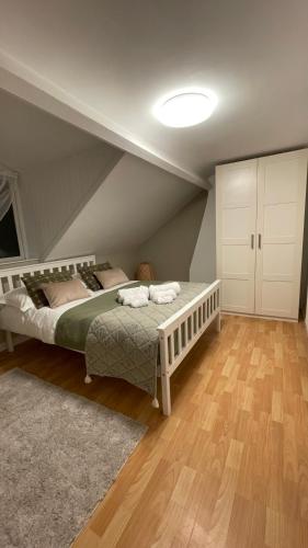 a bedroom with a bed in a room with a ceiling at Anyas rooms Ltd in Antrim
