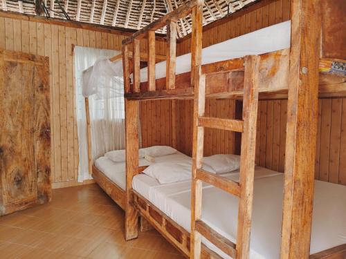a bedroom with two bunk beds in a room at Sawa Sawa Beach Hotel&Backpacks in Malindi