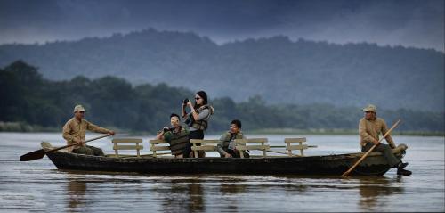 a group of people in a boat on the water at Barahi Jungle Lodge in Meghauli