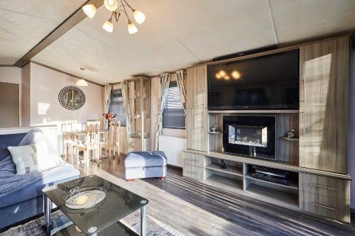 a living room with a large flat screen tv at Host & Stay - 10th Avenue in Morpeth