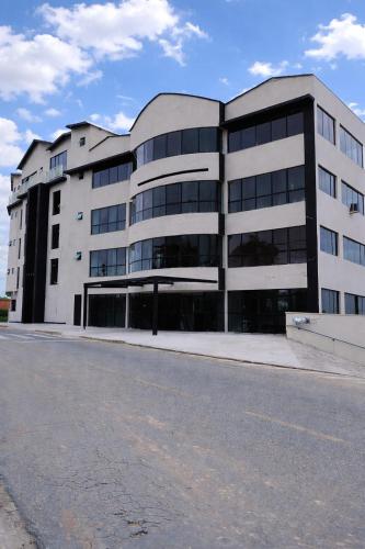 a large white building with a lot of windows at Hotel Bela Vista Palace in Araçariguama